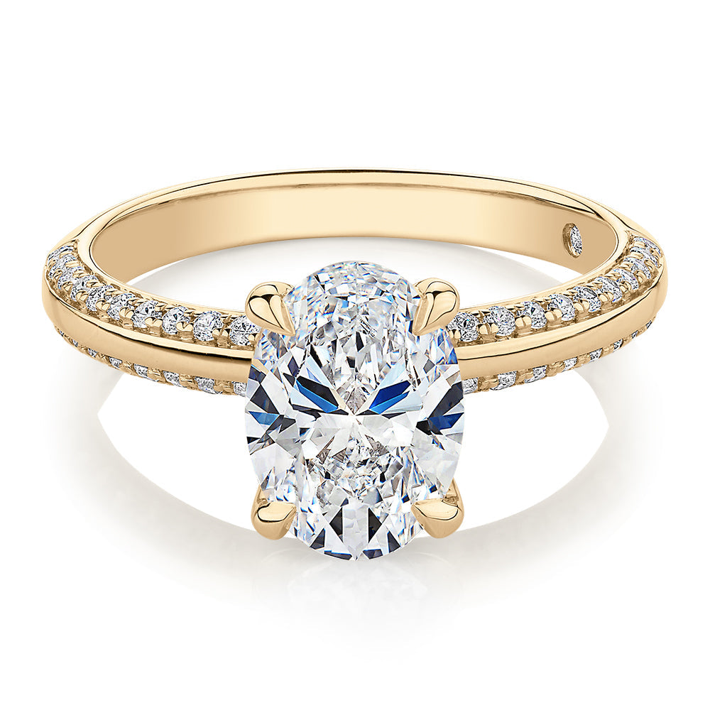 Signature Simulant Diamond 2.24 carat* TW round oval cut engagement ring in 10 carat yellow gold