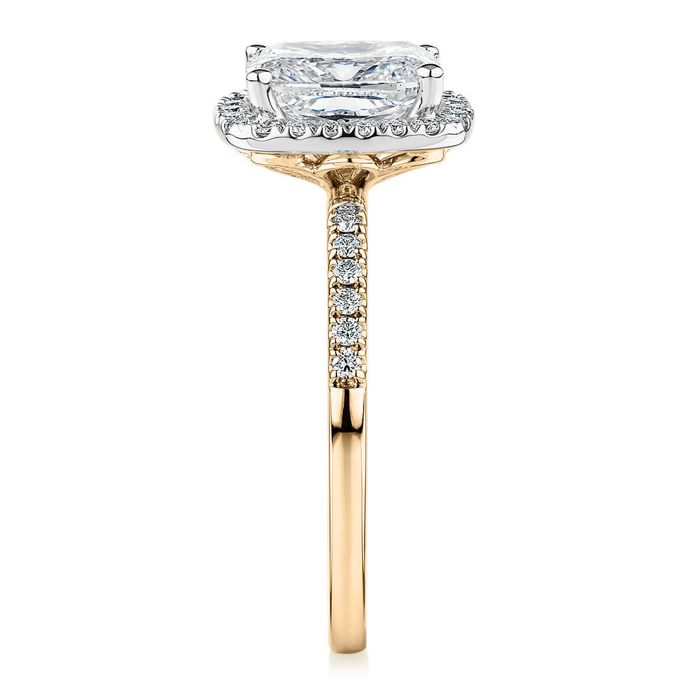 Signature Simulant Diamond 2.23 carat* TW radiant and round brilliant shouldered halo engagement ring in 10 carat yellow and white gold