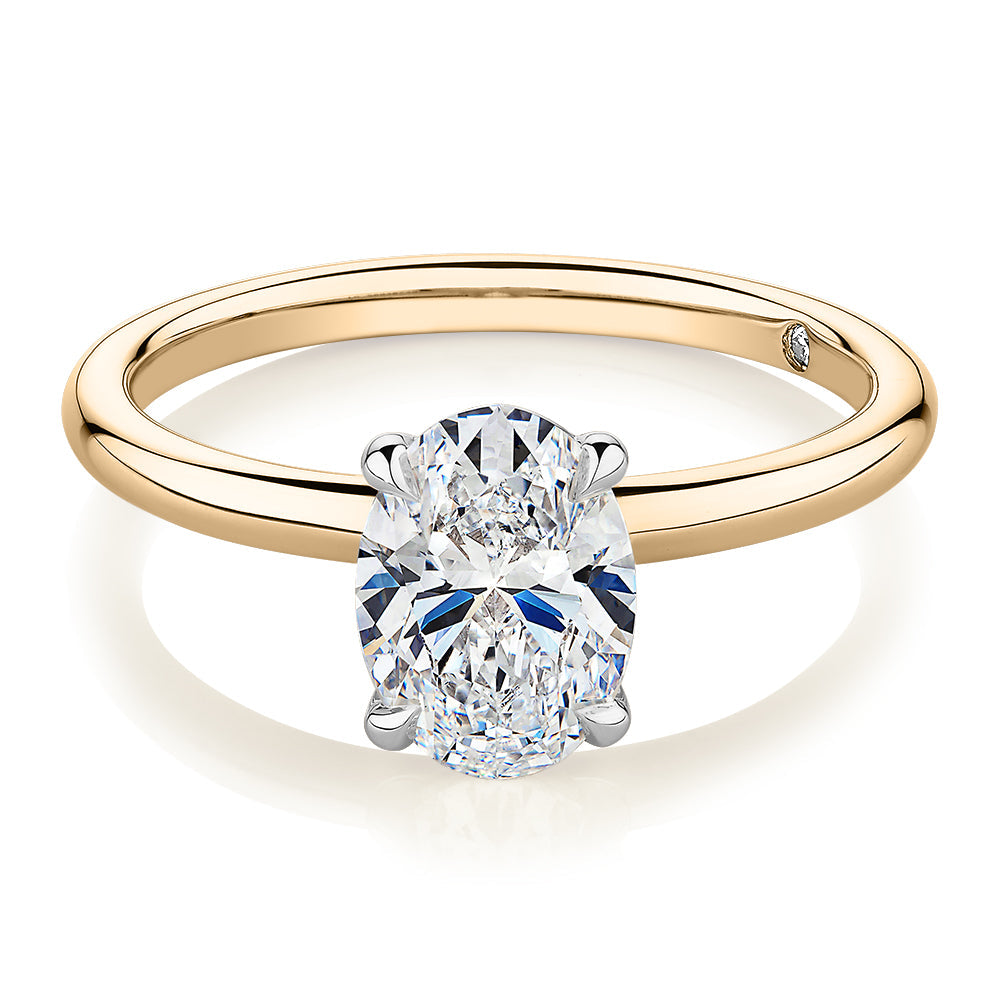 Signature Simulant Diamond 1.50 carat* oval solitaire engagement ring in 10 carat yellow and white gold