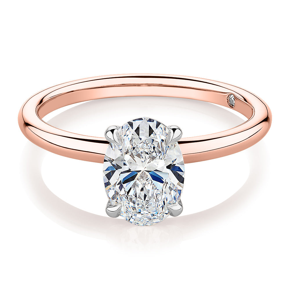 Signature Simulant Diamond 1.50 carat* oval solitaire engagement ring in 10 carat rose and white gold