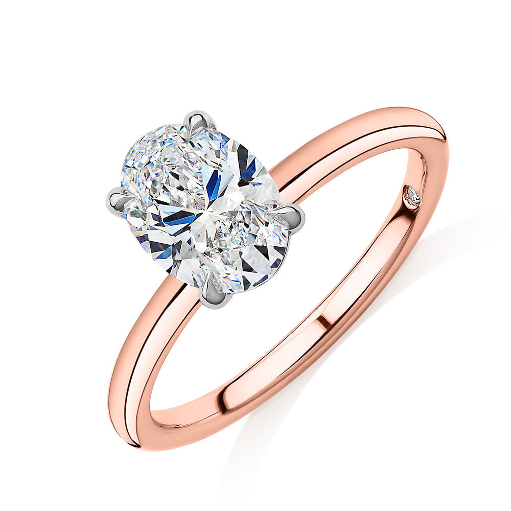 Signature Simulant Diamond 1.50 carat* oval solitaire engagement ring in 10 carat rose and white gold
