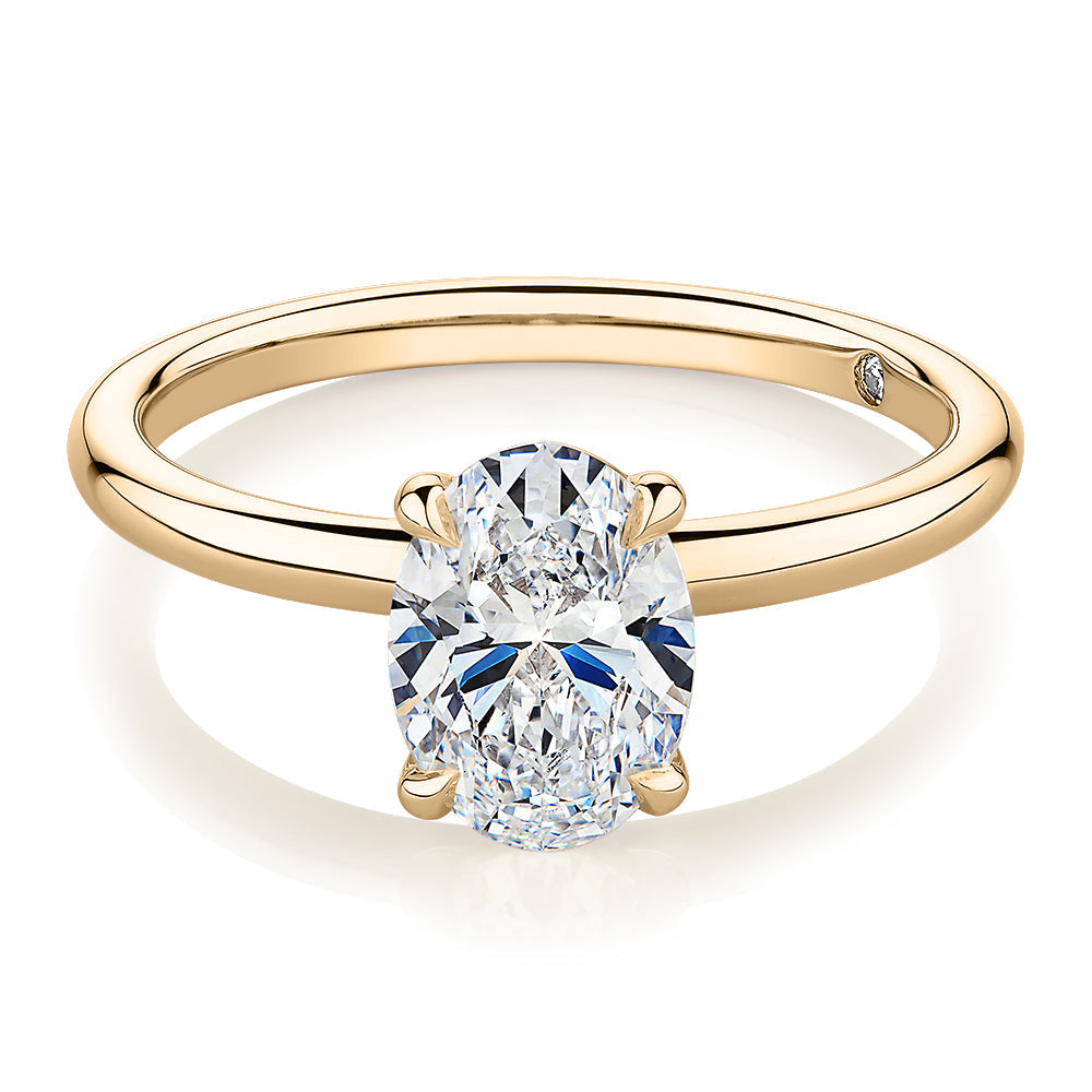 Signature Simulant Diamond 1.50 carat* oval solitaire engagement ring in 10 carat yellow gold