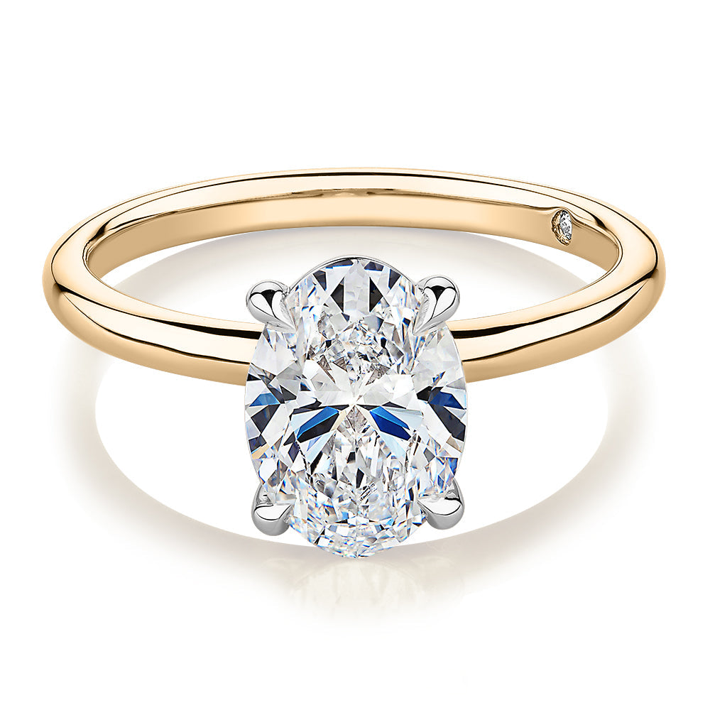 Signature Simulant Diamond 2.00 carat* oval solitaire engagement ring in 10 carat yellow and white gold