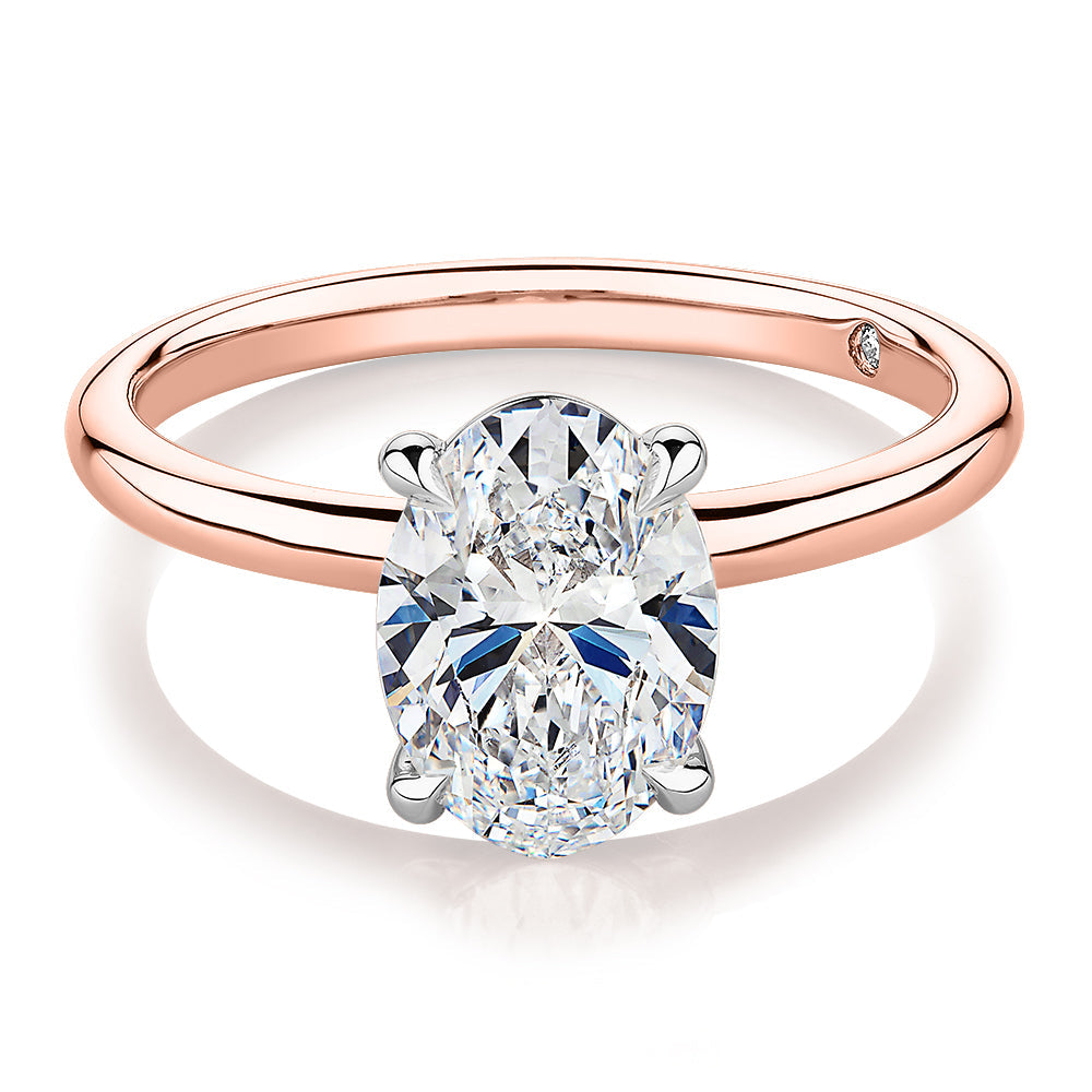 Signature Simulant Diamond 2.00 carat* oval solitaire engagement ring in 10 carat rose and white gold