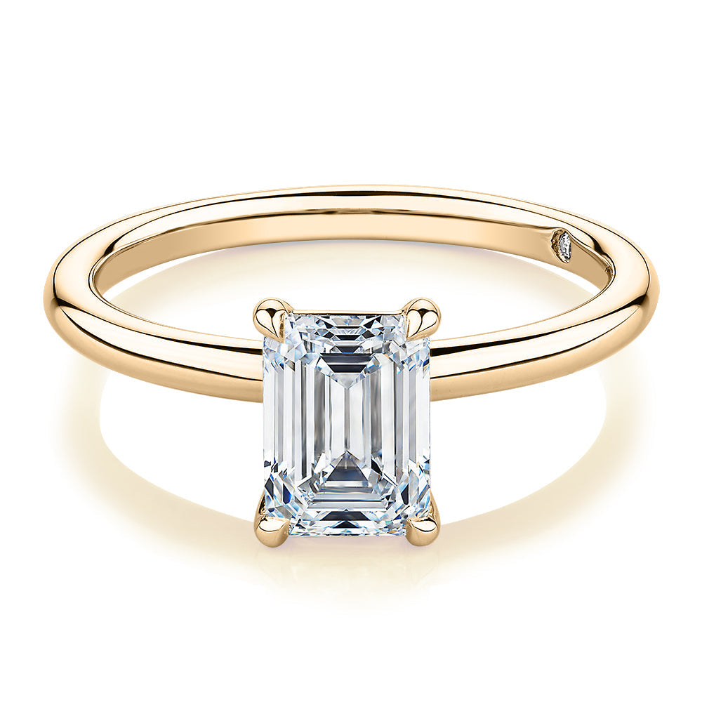 Signature Simulant Diamond 1.50 carat* emerald cut solitaire engagement ring in 10 carat yellow gold