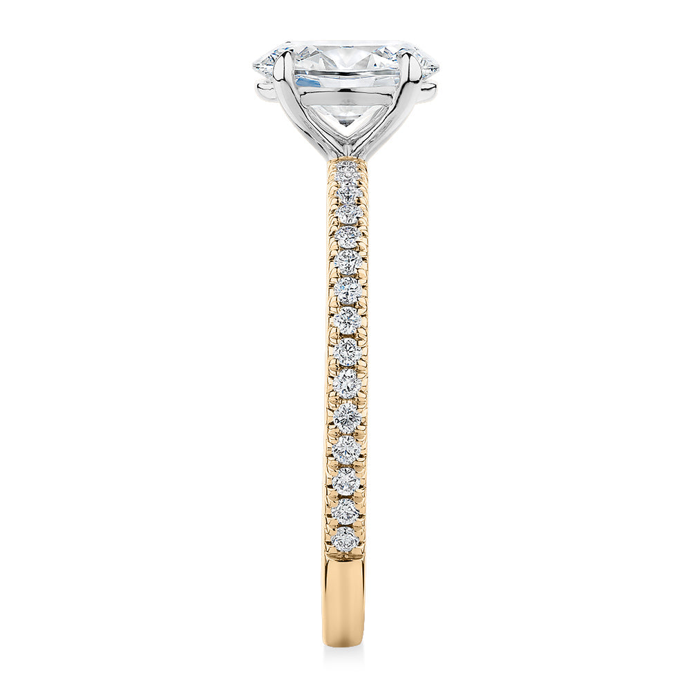 Signature Simulant Diamond 1.19 carat* TW oval cut shouldered engagement ring in 10 carat yellow and white gold