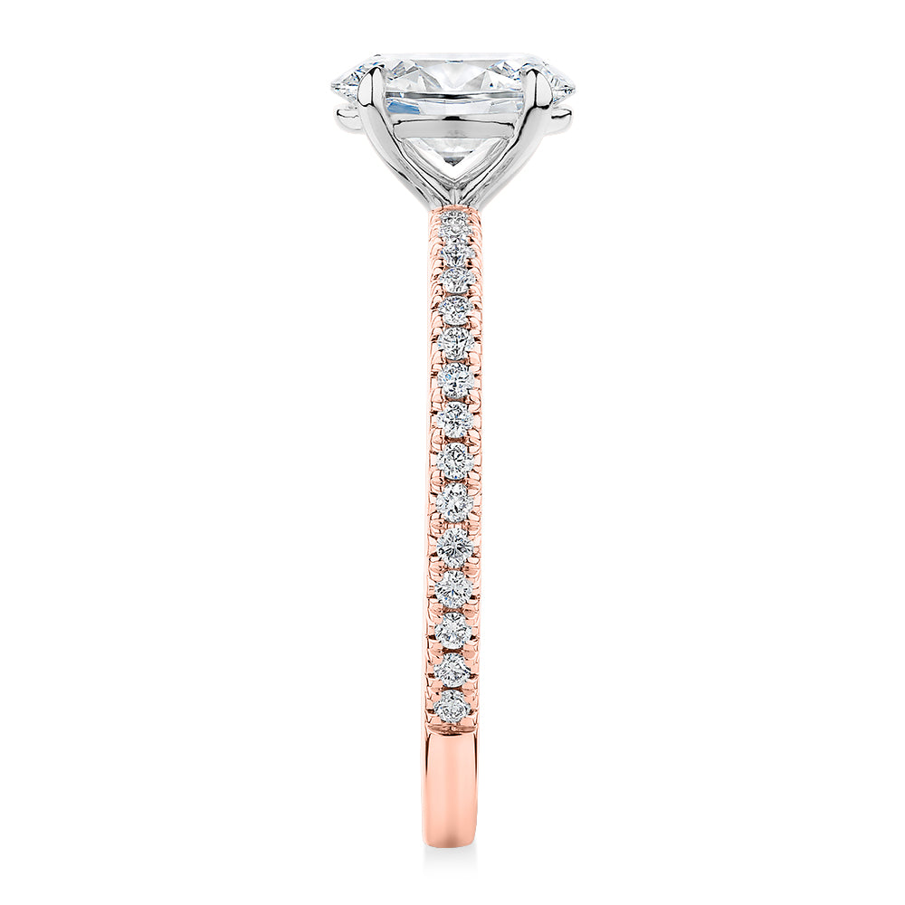 Signature Simulant Diamond 1.19 carat* TW oval cut shouldered engagement ring in 10 carat rose and white gold