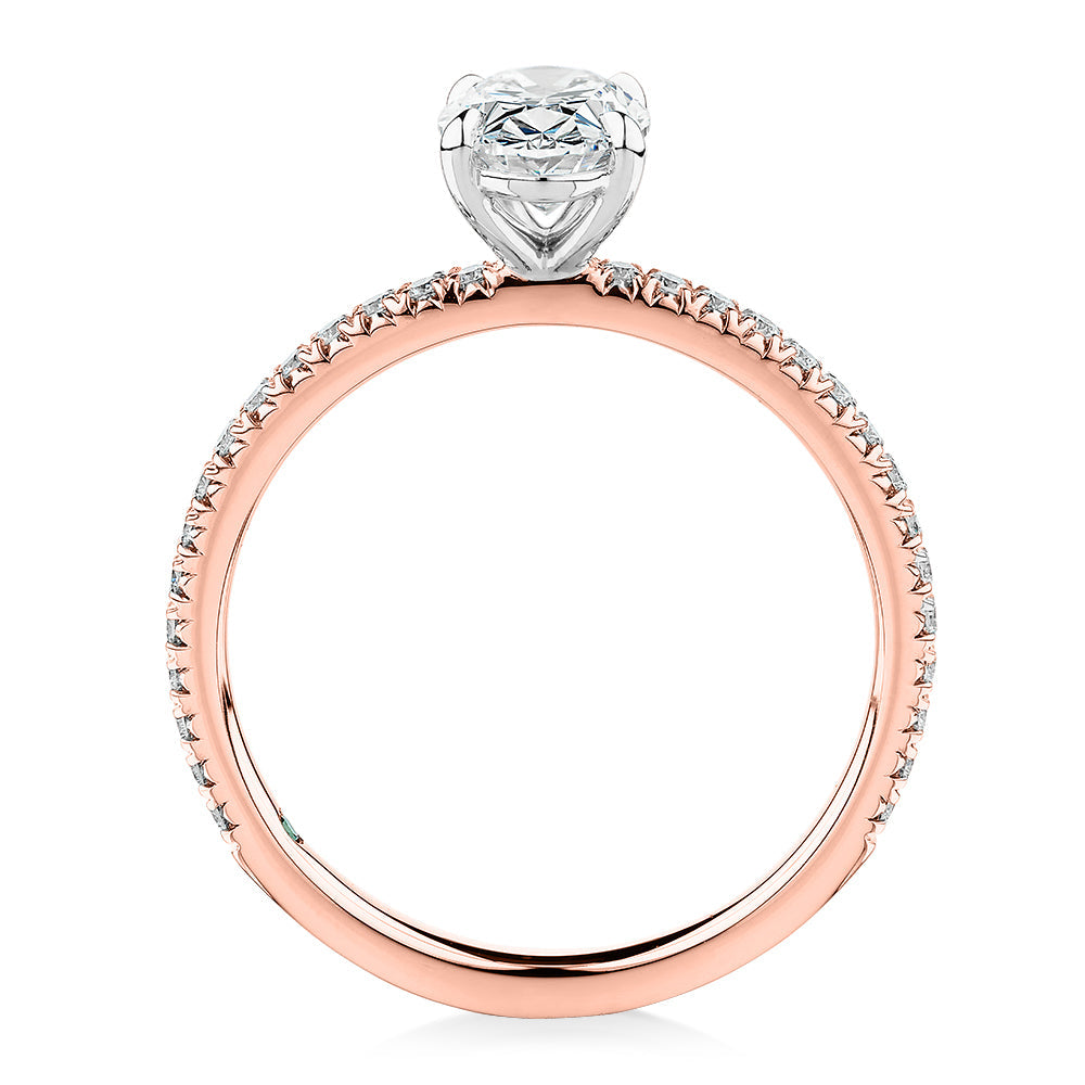 Signature Simulant Diamond 1.19 carat* TW oval cut shouldered engagement ring in 10 carat rose and white gold
