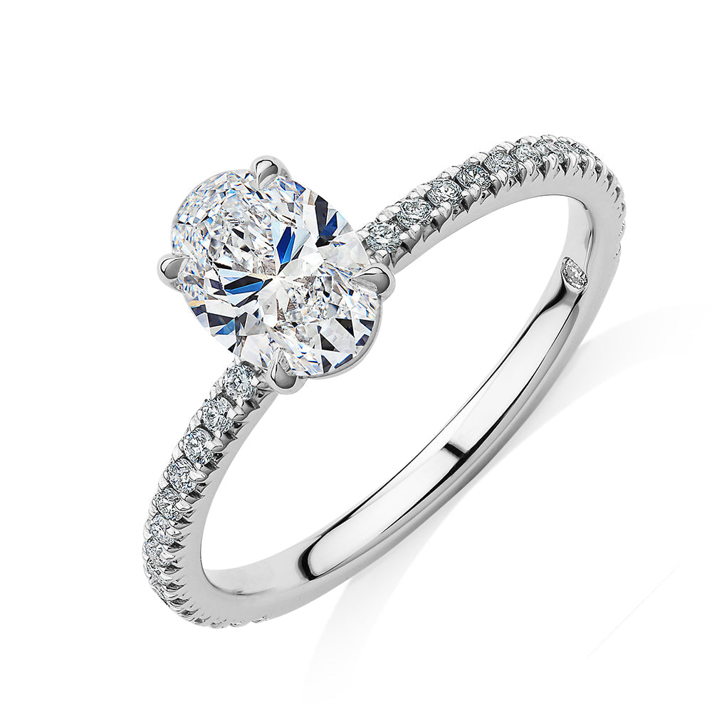 Signature Simulant Diamond 1.19 carat* TW oval cut shouldered engagement ring in 10 carat white gold