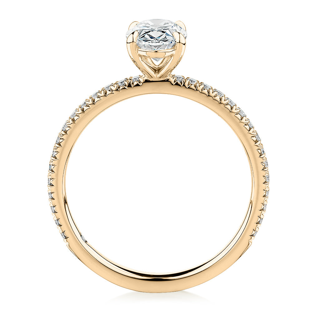 Signature Simulant Diamond 1.19 carat* TW round oval cut engagement ring in 10 carat yellow gold