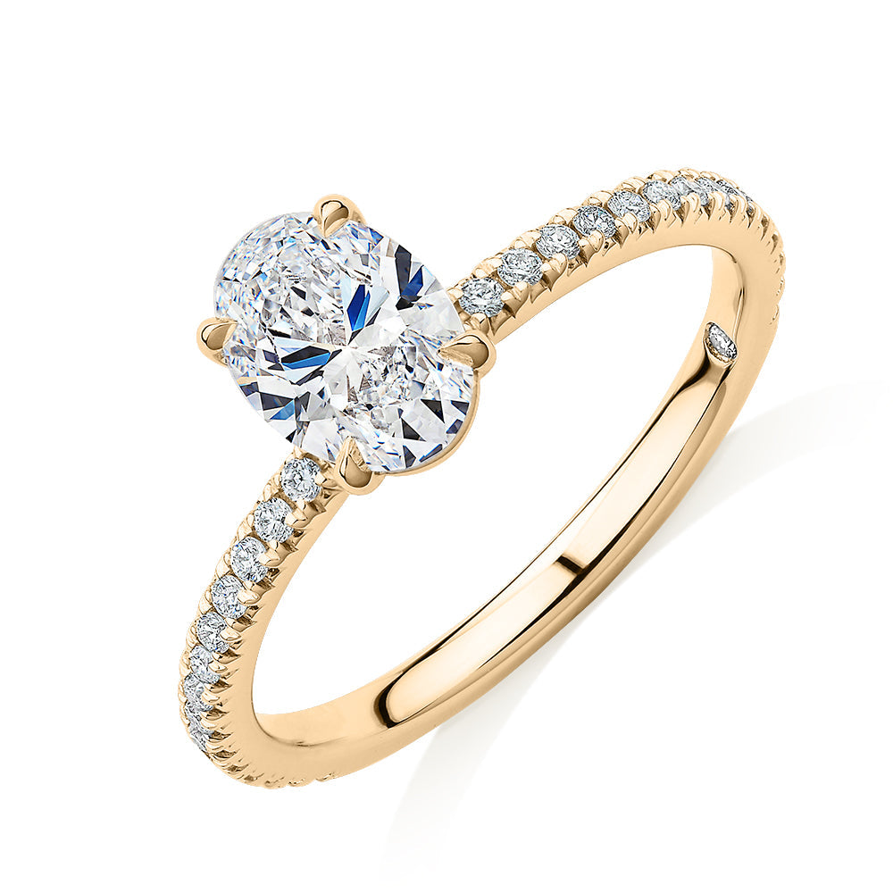 Signature Simulant Diamond 1.19 carat* TW round oval cut engagement ring in 10 carat yellow gold