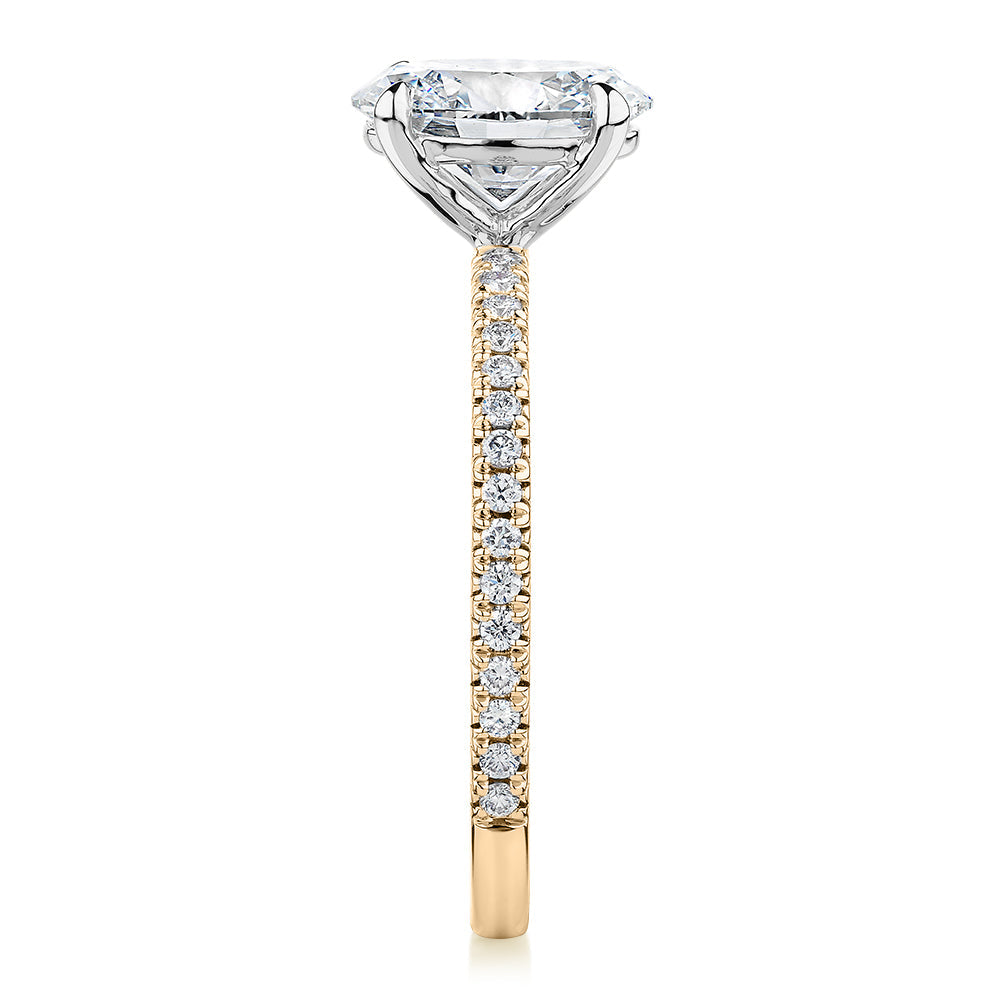 Signature Simulant Diamond 1.79 carat* TW oval cut shouldered engagement ring in 10 carat yellow and white gold