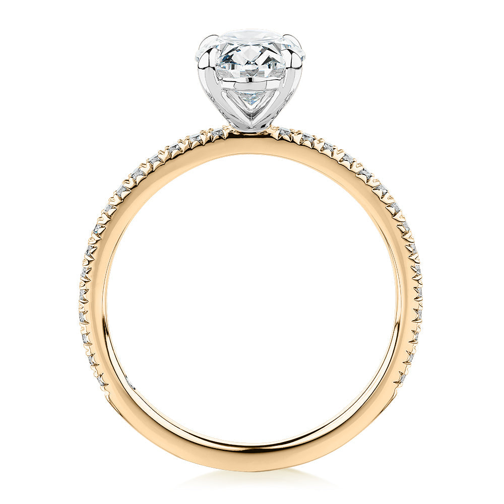 Signature Simulant Diamond 1.79 carat* TW oval cut shouldered engagement ring in 10 carat yellow and white gold