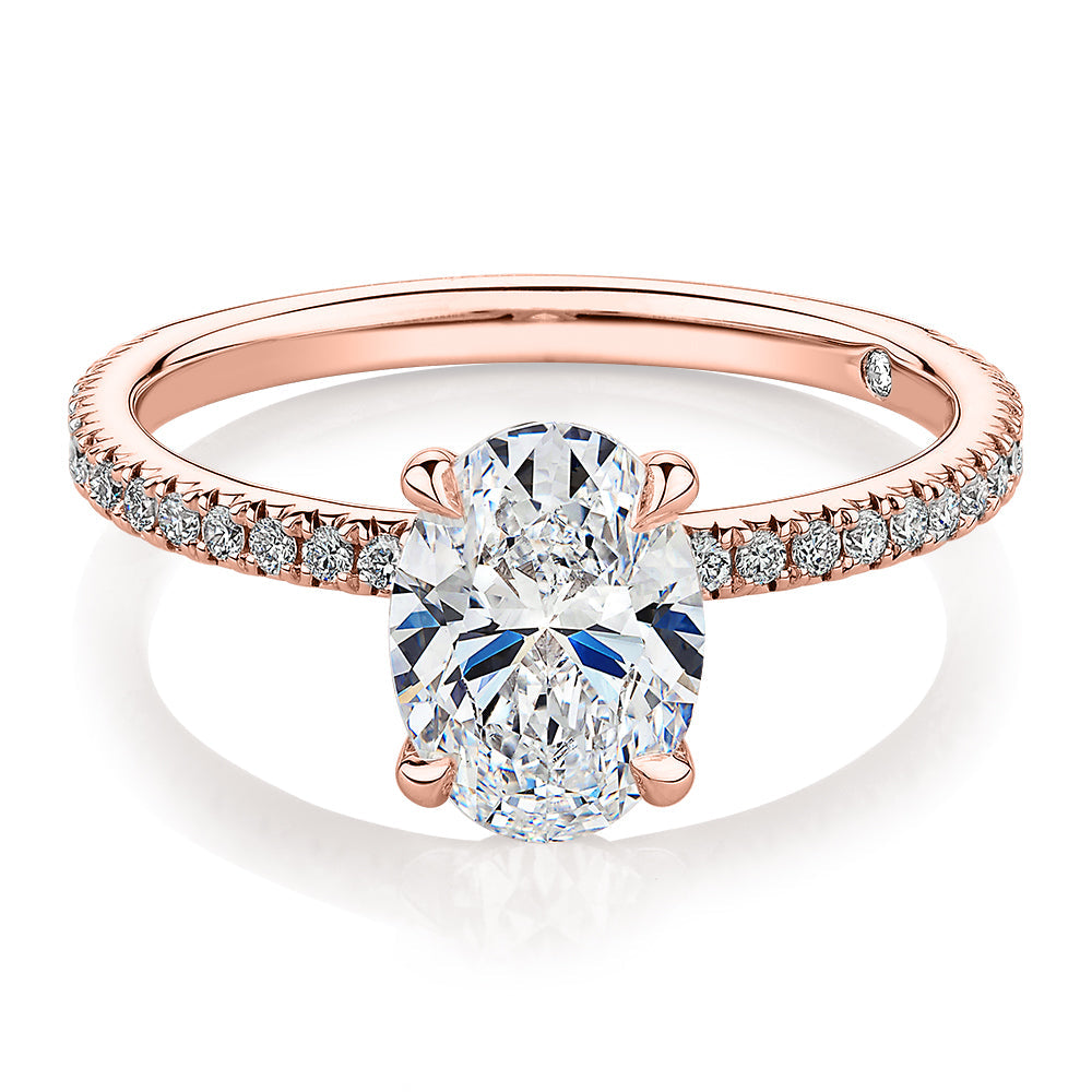 Signature Simulant Diamond 1.79 carat* TW oval cut shouldered engagement ring in 10 carat rose gold