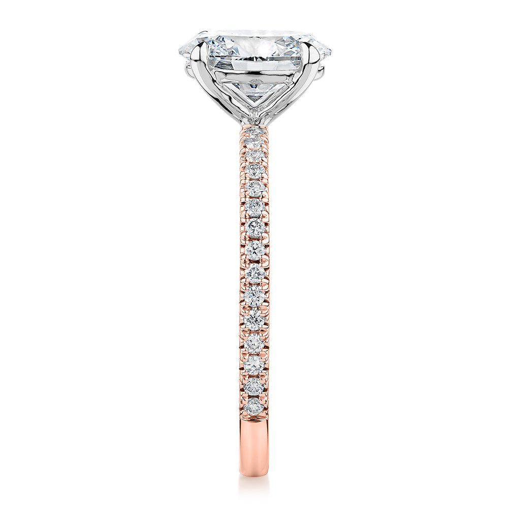 Signature Simulant Diamond 1.79 carat* TW oval cut shouldered engagement ring in 10 carat rose and white gold