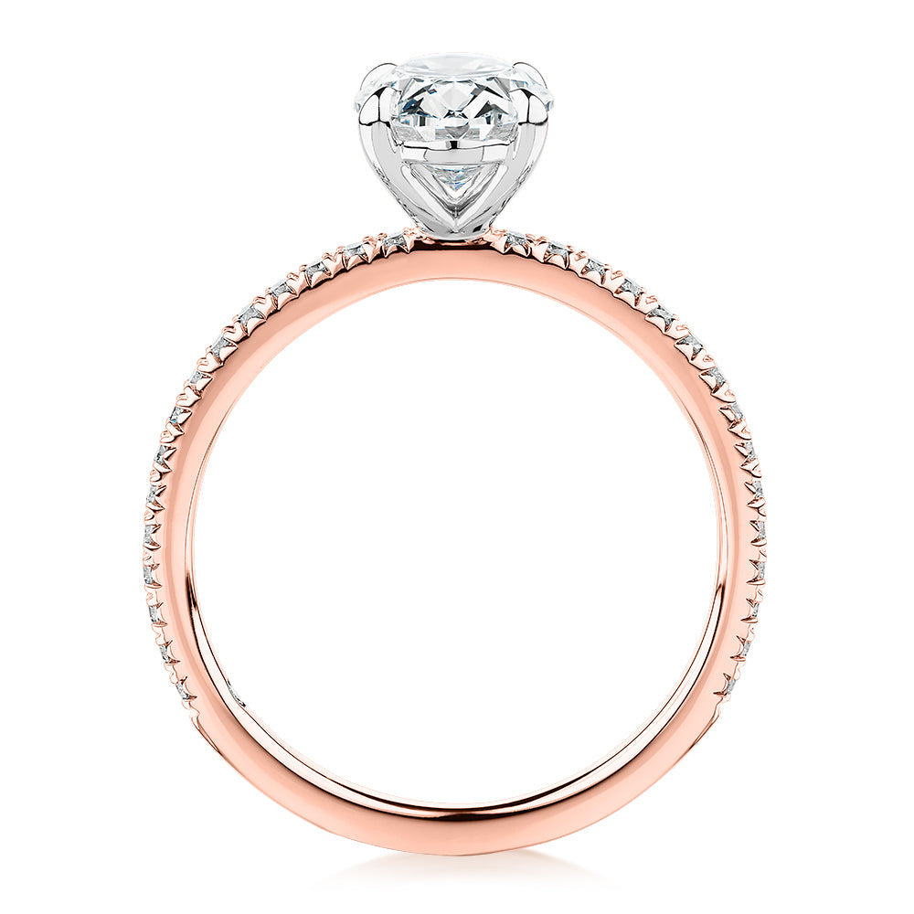 Signature Simulant Diamond 1.79 carat* TW oval cut shouldered engagement ring in 10 carat rose and white gold