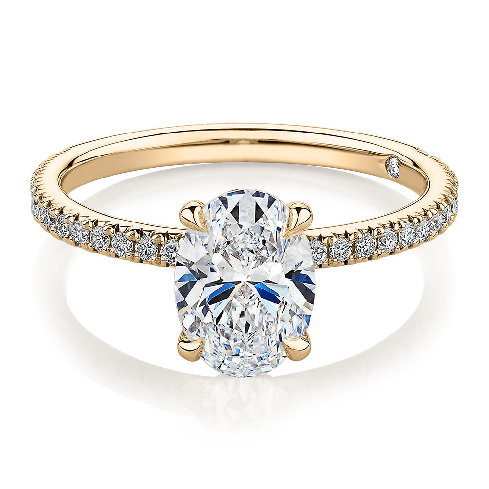 Signature Simulant Diamond 1.79 carat* TW round oval cut engagement ring in 10 carat yellow gold