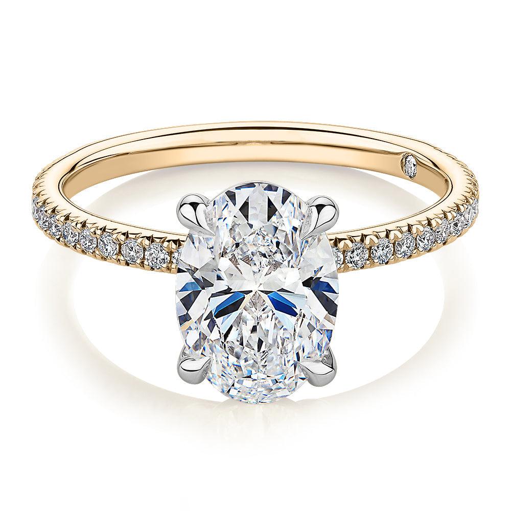 Signature Simulant Diamond 2.19 carat* TW oval cut shouldered engagement ring in 10 carat yellow and white gold