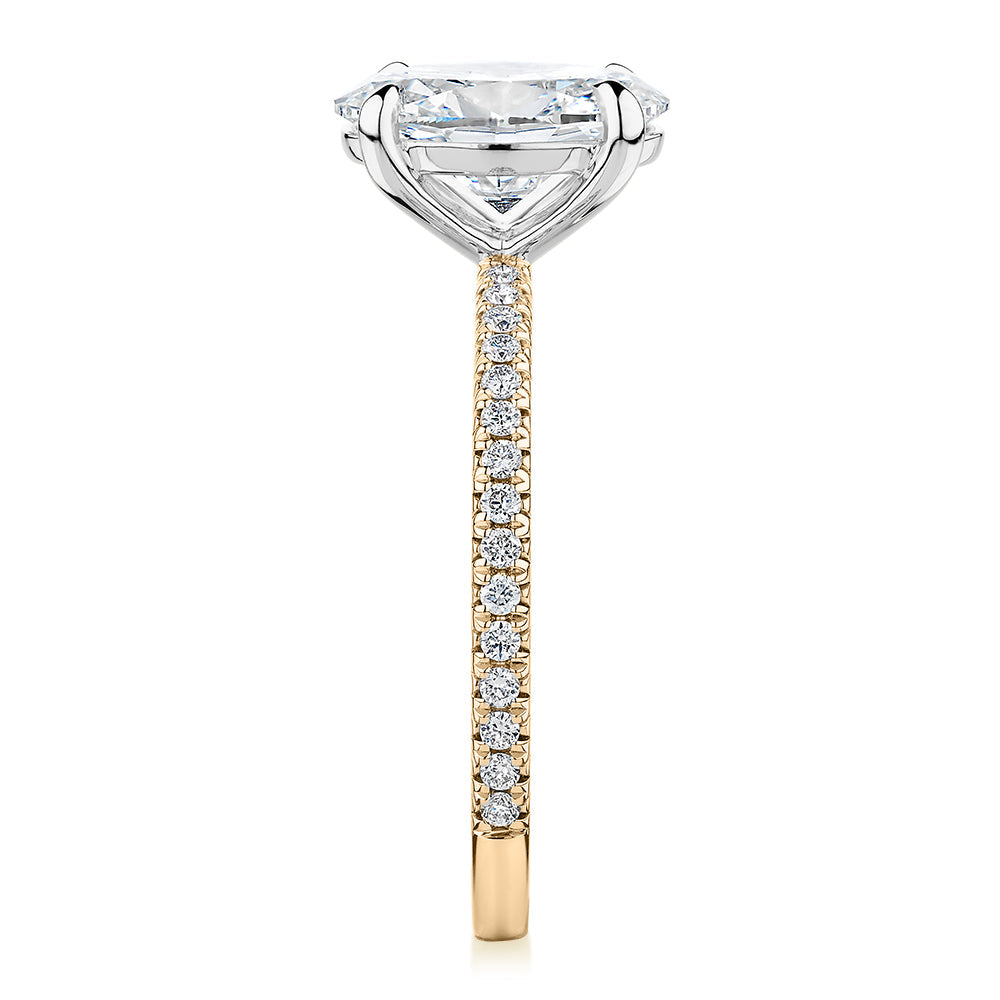 Signature Simulant Diamond 2.19 carat* TW oval cut shouldered engagement ring in 10 carat yellow and white gold