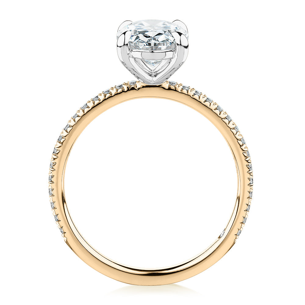Signature Simulant Diamond 2.19 carat* TW oval cut shouldered engagement ring in 10 carat yellow and white gold
