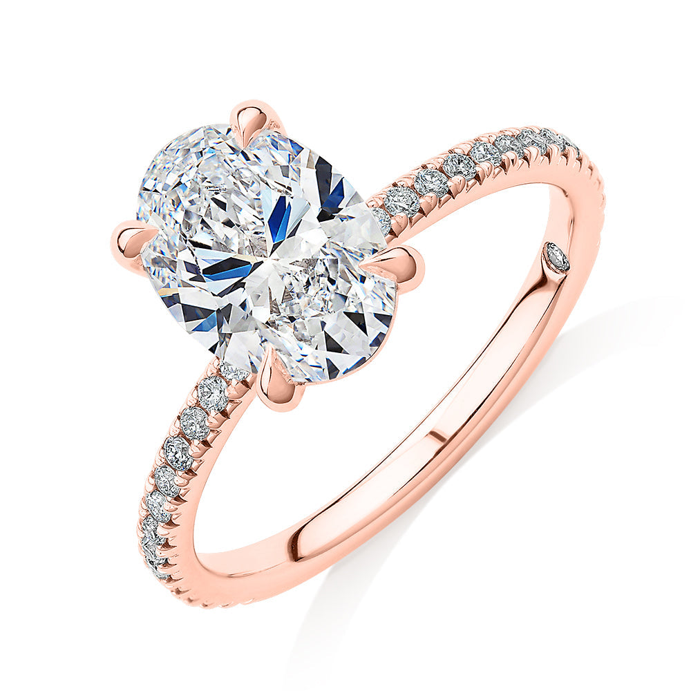 Signature Simulant Diamond 2.19 carat* TW oval cut shouldered engagement ring in 10 carat rose gold