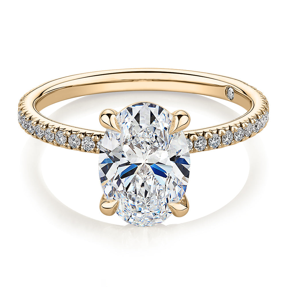 Signature Simulant Diamond 2.19 carat* TW round oval cut engagement ring in 10 carat yellow gold