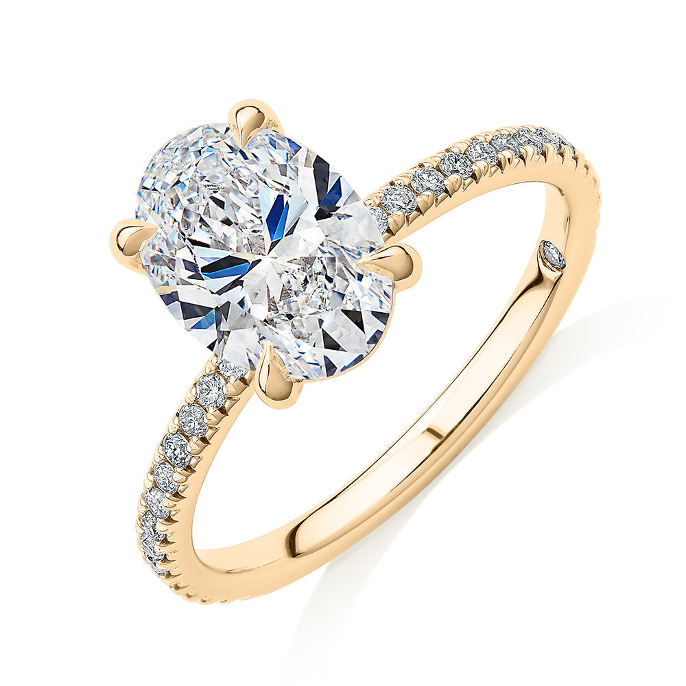 Signature Simulant Diamond 2.19 carat* TW round oval cut engagement ring in 10 carat yellow gold