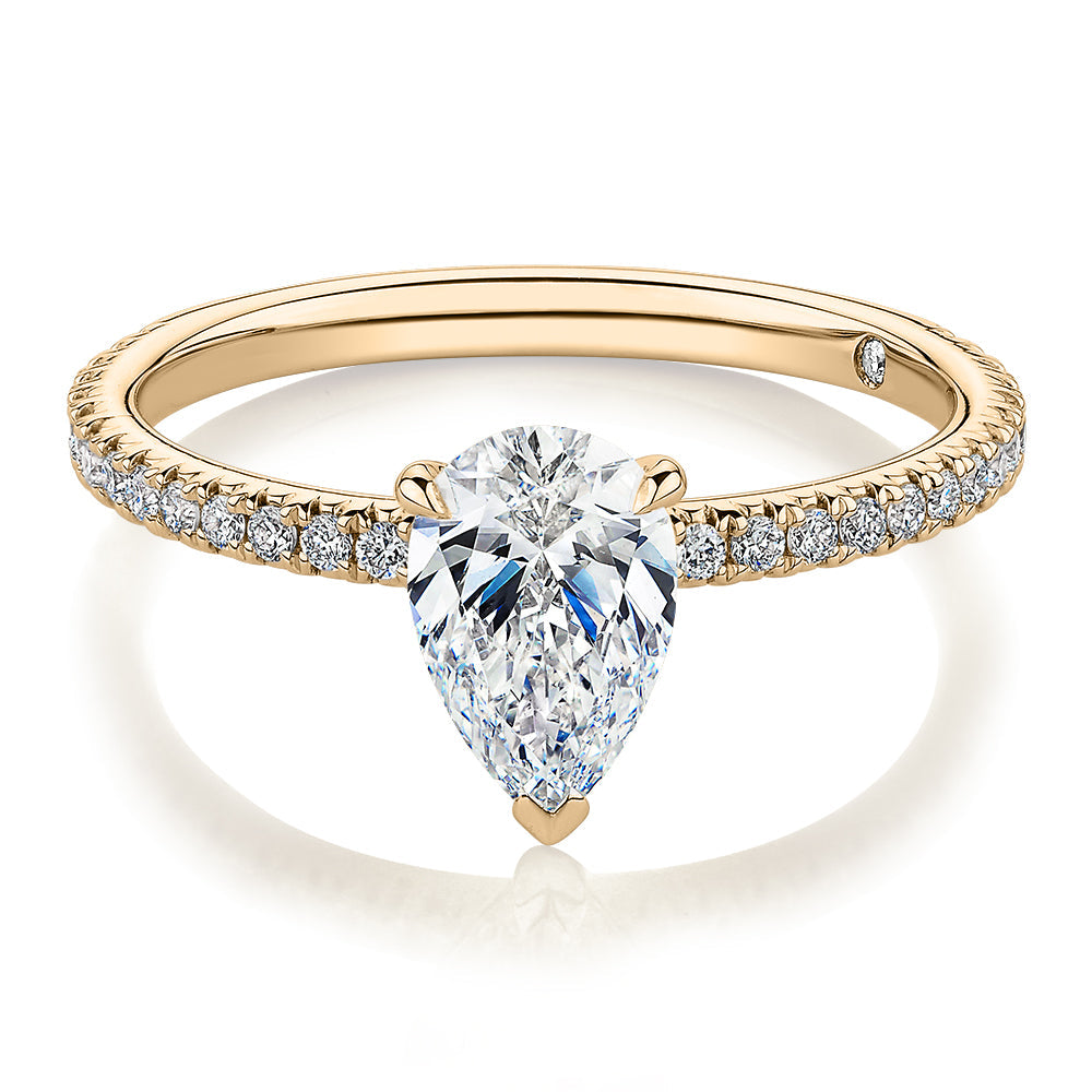 Signature Simulant Diamond 1.24 carat* TW pear and round brilliant shouldered engagement ring in 10 carat yellow gold