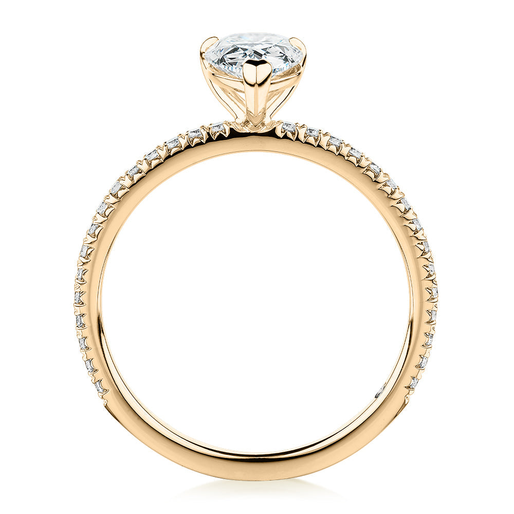 Signature Simulant Diamond 1.24 carat* TW pear and round brilliant shouldered engagement ring in 10 carat yellow gold