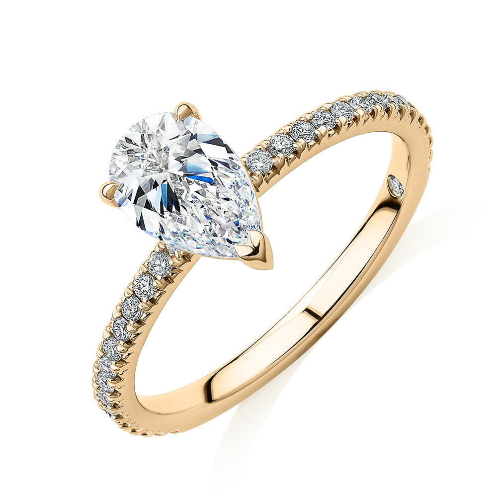 Signature Simulant Diamond 1.24 carat* TW pear and round brilliant shouldered engagement ring in 10 carat yellow gold