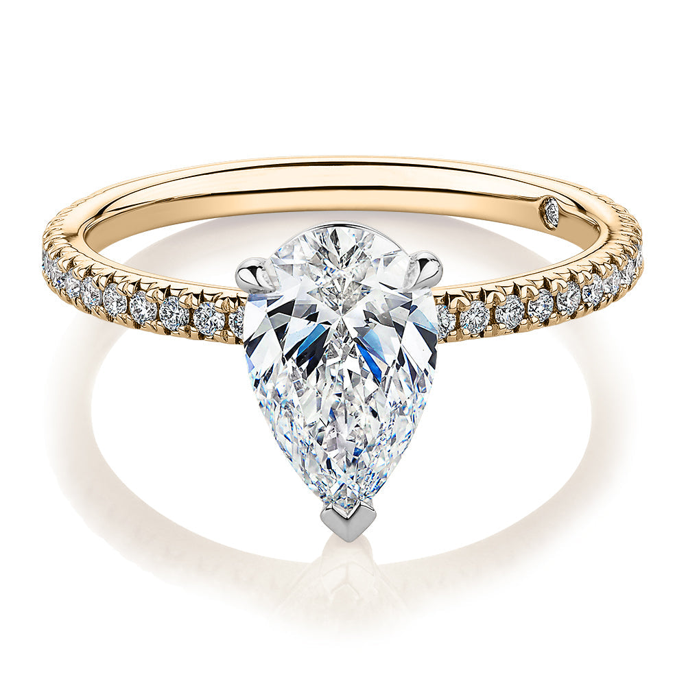 Signature Simulant Diamond 1.74 carat* TW pear and round brilliant shouldered engagement ring in 10 carat yellow and white gold