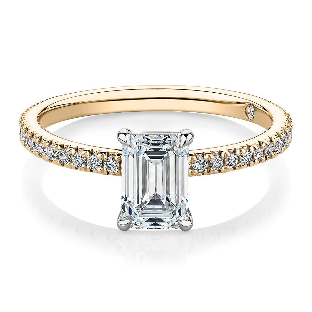Signature Simulant Diamond 1.24 carat* TW emerald cut and round brilliant shouldered engagement ring in 10 carat yellow and white gold