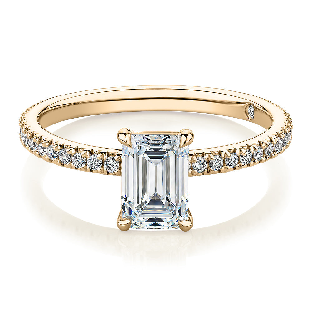 Signature Simulant Diamond 1.24 carat* TW emerald cut and round brilliant shouldered engagement ring in 10 carat yellow gold