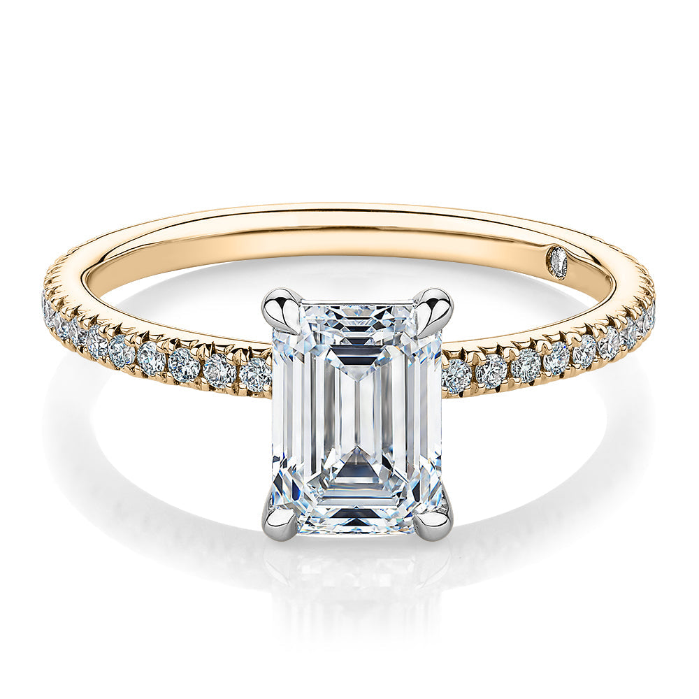 Signature Simulant Diamond 1.74 carat* TW emerald cut and round brilliant shouldered engagement ring in 10 carat yellow and white gold