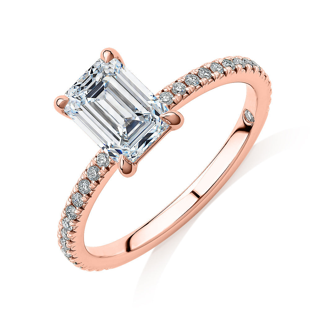 Signature Simulant Diamond 1.74 carat* TW emerald cut and round brilliant shouldered engagement ring in 10 carat rose gold