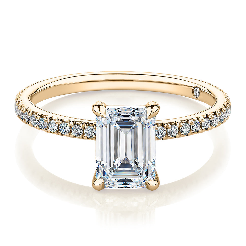 Signature Simulant Diamond 1.74 carat* TW emerald cut and round brilliant shouldered engagement ring in 10 carat yellow gold
