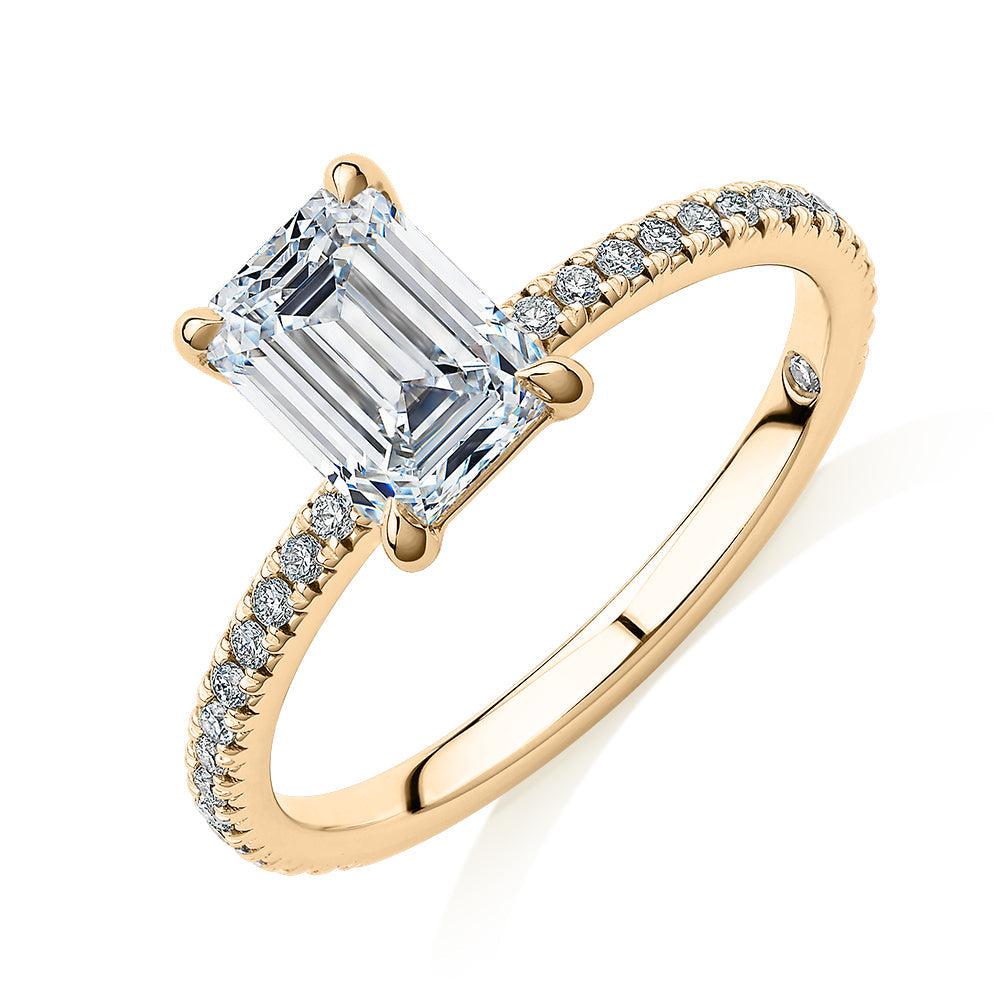 Signature Simulant Diamond 1.74 carat* TW emerald cut and round brilliant shouldered engagement ring in 10 carat yellow gold