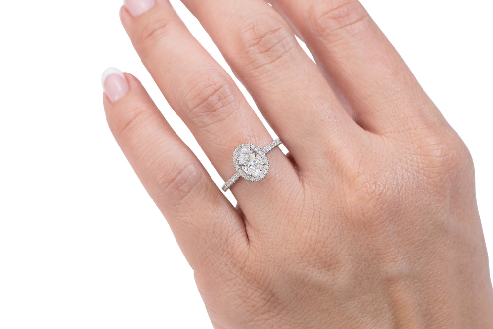 Signature Simulant Diamond 1.37 carat* TW oval and round brilliant halo engagement ring in 10 carat white gold