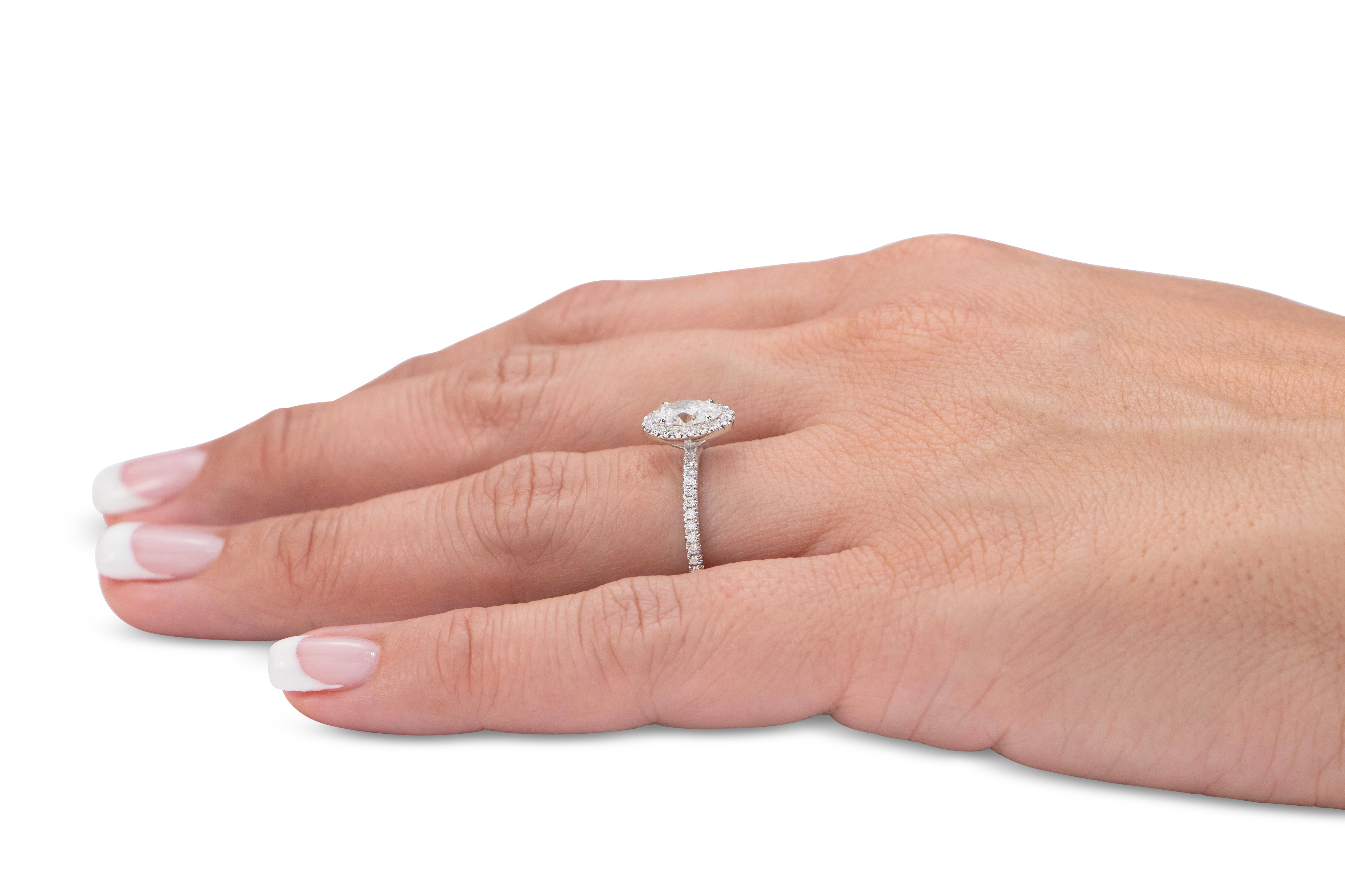 Signature Simulant Diamond 1.37 carat* TW oval and round brilliant halo engagement ring in 10 carat white gold