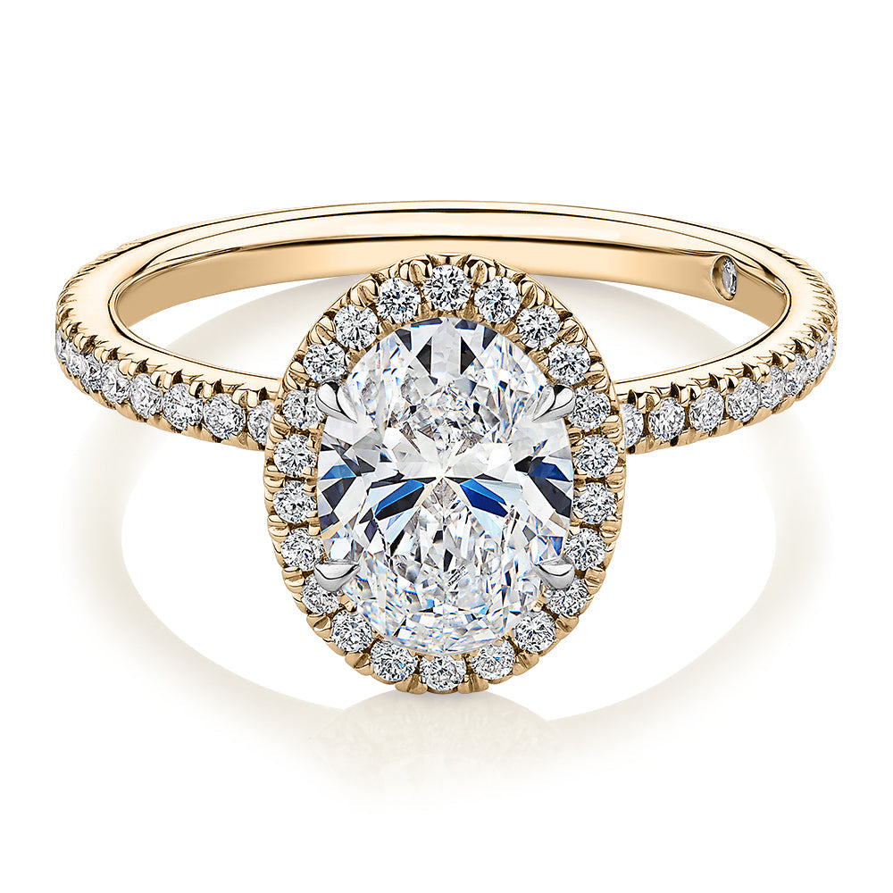 Signature Simulant Diamond 1.83 carat* TW oval and round brilliant halo engagement ring in 10 carat yellow and white gold