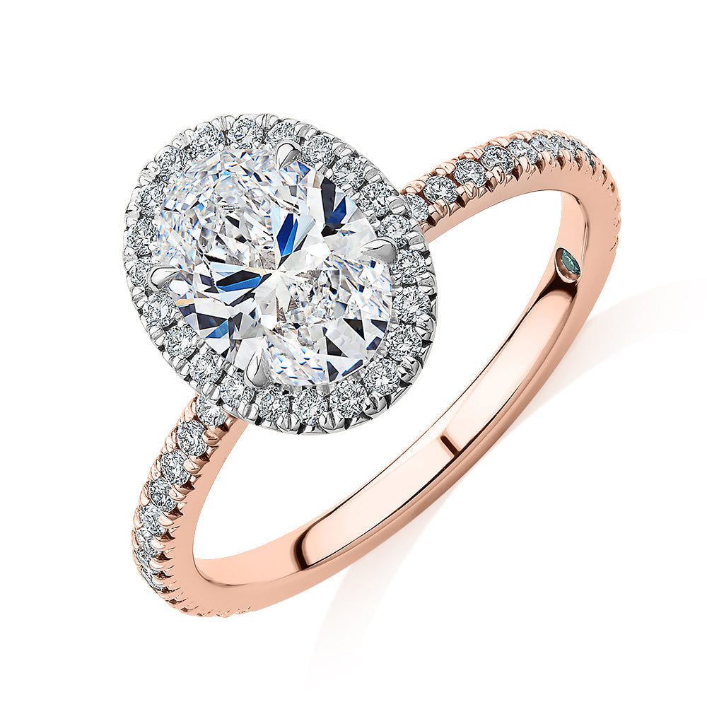 Signature Simulant Diamond 1.89 carat* TW oval and round brilliant halo engagement ring in 18 carat rose and white gold