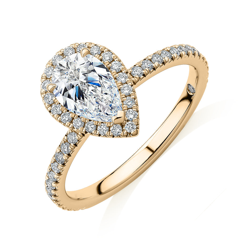 Signature Simulant Diamond 1.37 carat* TW pear and round brilliant halo engagement ring in 10 carat yellow gold