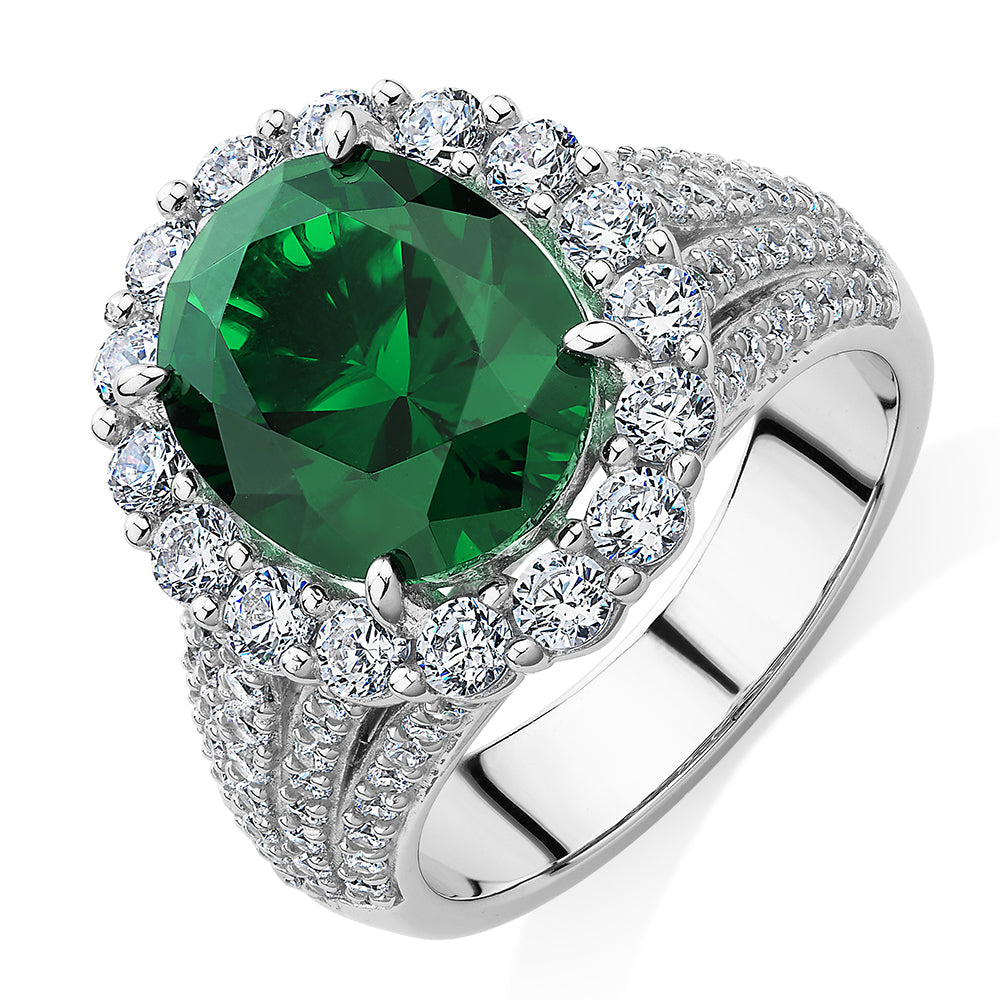 Dress ring with emerald simulant and 6.35 carats* of diamond simulants in sterling silver